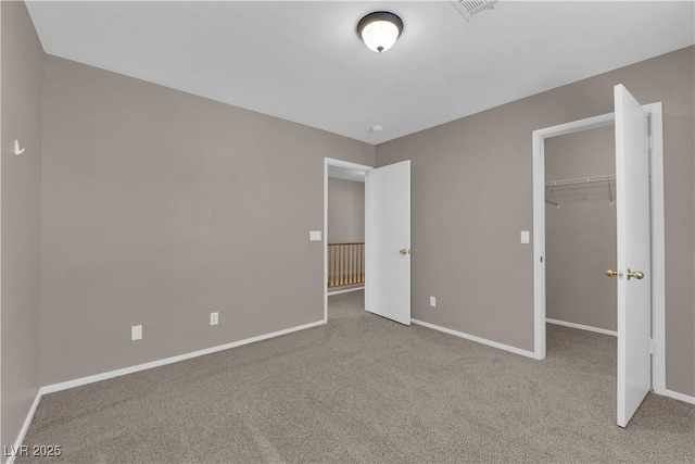 1553 Ivygate Ave, Las Vegas, NV 89183 - unfurnished bedroom featuring carpet, a spacious closet, and a closet