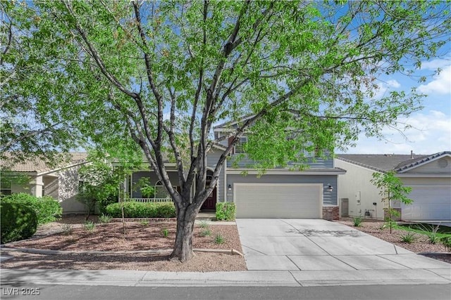 1553 Ivygate Ave, Las Vegas, NV 89183 - obstructed view of property with concrete driveway and brick siding