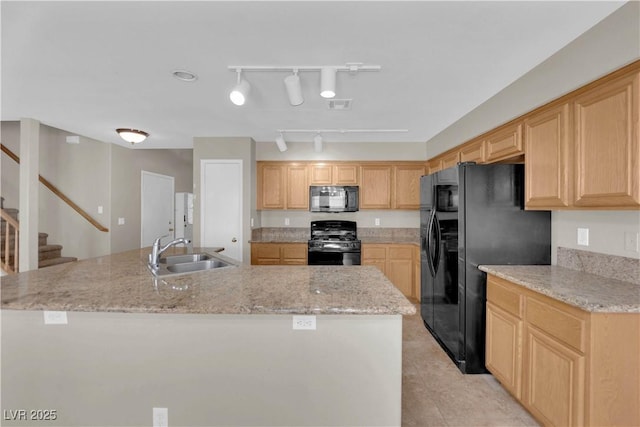 1553 Ivygate Ave, Las Vegas, NV 89183 - kitchen with black appliances, an island with sink, light tile patterned flooring, and light brown cabinets