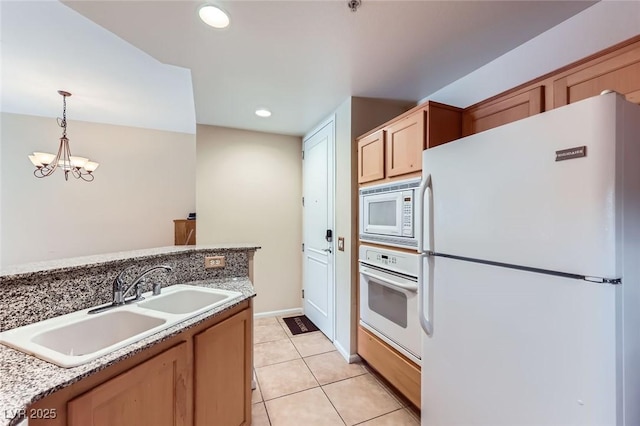 43 E Agate Ave Unit 302, Las Vegas, NV 89123 - kitchen featuring white appliances, a chandelier, pendant lighting, light tile patterned flooring, and recessed lighting