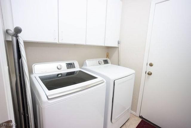 5935 Saddle Horse Ave, Las Vegas, NV 89122 - laundry room with washing machine and dryer, cabinet space, and light tile patterned floors