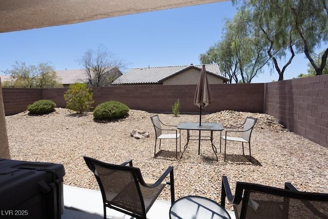 5935 Saddle Horse Ave, Las Vegas, NV 89122 - fenced backyard featuring a patio and outdoor dining space