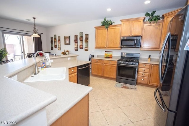 5935 Saddle Horse Ave, Las Vegas, NV 89122 - kitchen featuring stainless steel appliances, light countertops, recessed lighting, pendant lighting, and light tile patterned floors