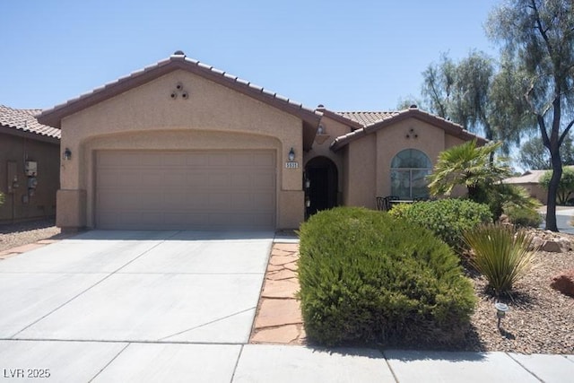 5935 Saddle Horse Ave, Las Vegas, NV 89122 - mediterranean / spanish-style home featuring stucco siding, a garage, a tile roof, and driveway