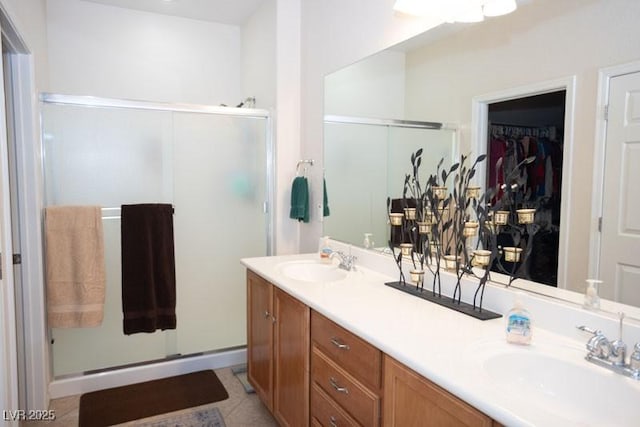 5935 Saddle Horse Ave, Las Vegas, NV 89122 - bathroom with a stall shower, double vanity, and a walk in closet