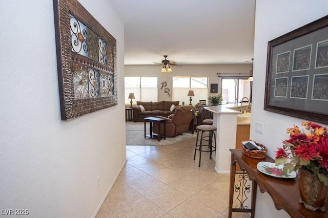 5935 Saddle Horse Ave, Las Vegas, NV 89122 - corridor featuring baseboards and light tile patterned flooring