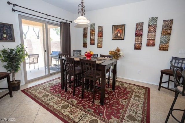5935 Saddle Horse Ave, Las Vegas, NV 89122 - dining room with light tile patterned floors and baseboards