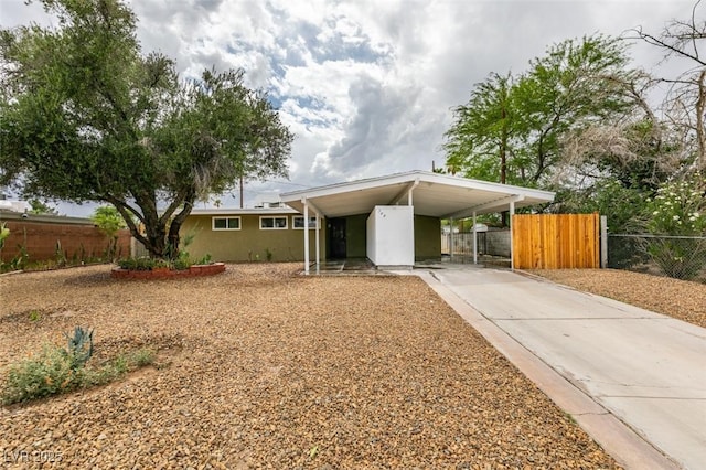 709 N 22nd St, Las Vegas, NV 89101 - view of front of home featuring a carport, stucco siding, and driveway