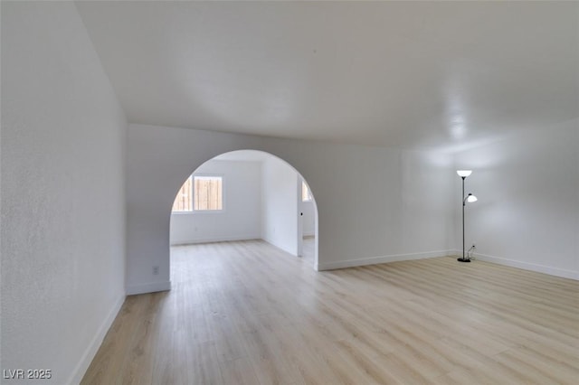 709 N 22nd St, Las Vegas, NV 89101 - bonus room with light wood-style flooring and arched walkways