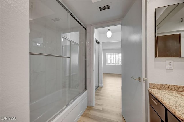 2732 Heritage Ct, Las Vegas, NV 89121 - bathroom featuring vanity and shower / bath combination with glass door