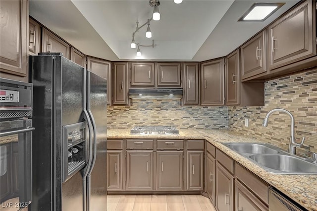 2732 Heritage Ct, Las Vegas, NV 89121 - kitchen with black appliances, under cabinet range hood, backsplash, and dark brown cabinetry