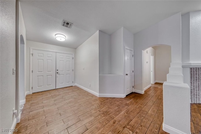 1643 Silver Slipper Ave, Henderson, NV 89002 - foyer featuring arched walkways and light wood finished floors