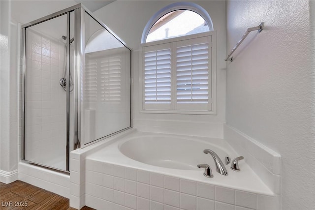1643 Silver Slipper Ave, Henderson, NV 89002 - full bathroom featuring a shower stall, a garden tub, and wood finished floors