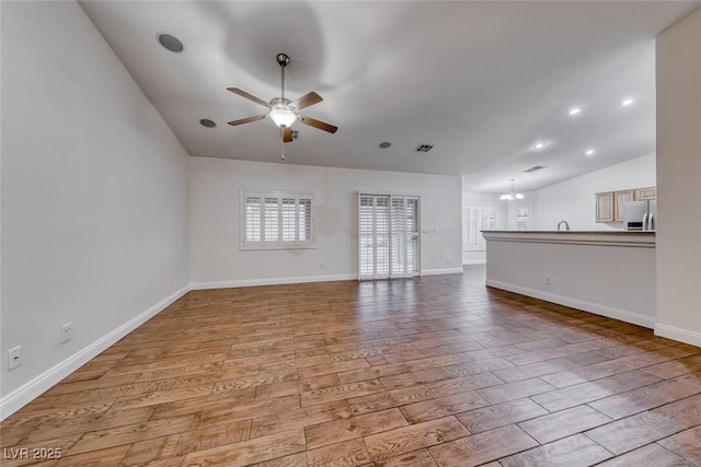 1643 Silver Slipper Ave, Henderson, NV 89002 - unfurnished living room with lofted ceiling, ceiling fan, and wood finished floors