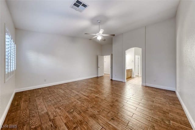 1643 Silver Slipper Ave, Henderson, NV 89002 - unfurnished room with arched walkways, ceiling fan, wood finished floors, and vaulted ceiling