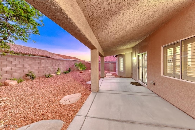1643 Silver Slipper Ave, Henderson, NV 89002 - patio terrace at dusk with a fenced backyard and a patio