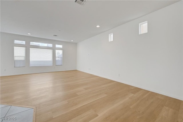 7775 Tyrell Peaks St, Las Vegas, NV 89139 - empty room featuring light wood-style flooring, plenty of natural light, and recessed lighting