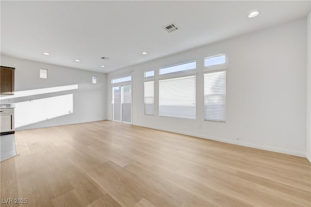 7775 Tyrell Peaks St, Las Vegas, NV 89139 - unfurnished living room featuring light wood-type flooring and recessed lighting