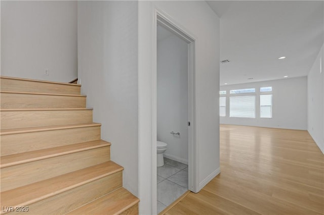 7775 Tyrell Peaks St, Las Vegas, NV 89139 - staircase featuring wood finished floors and recessed lighting