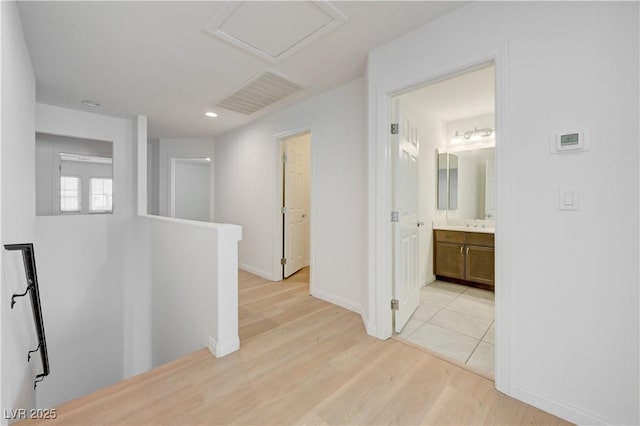 7775 Tyrell Peaks St, Las Vegas, NV 89139 - hall featuring an upstairs landing, light wood finished floors, recessed lighting, and attic access