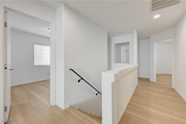 7775 Tyrell Peaks St, Las Vegas, NV 89139 - hallway featuring an upstairs landing, light wood-style floors, and recessed lighting