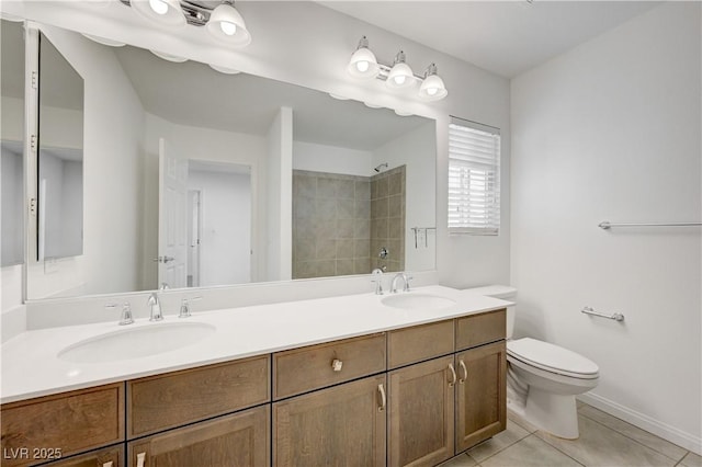 7775 Tyrell Peaks St, Las Vegas, NV 89139 - bathroom featuring double vanity, tiled shower, and tile patterned floors