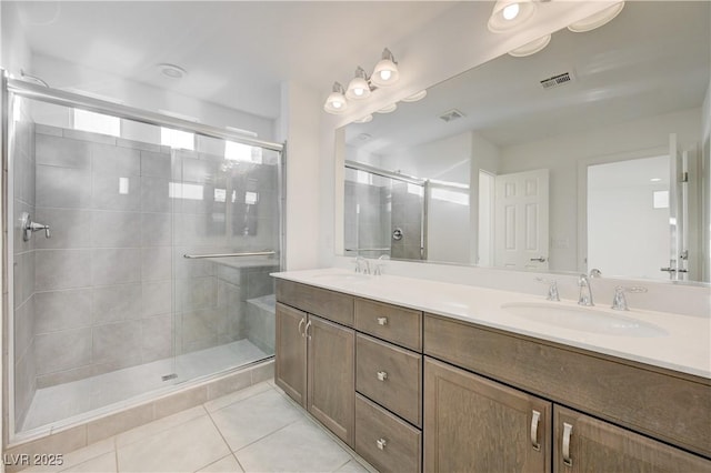 7775 Tyrell Peaks St, Las Vegas, NV 89139 - full bath with double vanity, a shower stall, and tile patterned floors