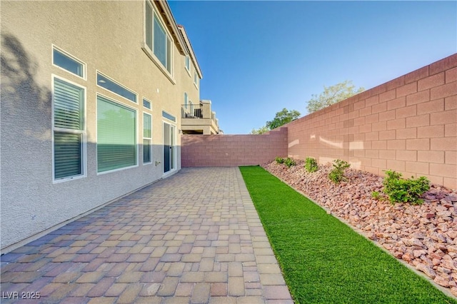 7775 Tyrell Peaks St, Las Vegas, NV 89139 - fenced backyard featuring a patio