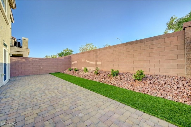 7775 Tyrell Peaks St, Las Vegas, NV 89139 - fenced backyard featuring a patio