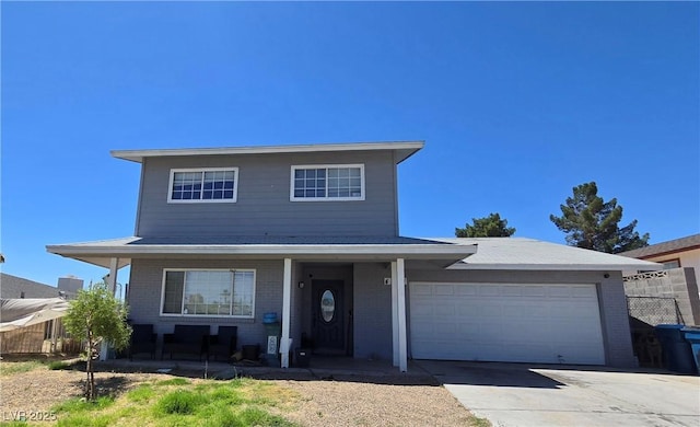 4291 Powell Ave, Las Vegas, NV 89121 - traditional home featuring brick siding, an attached garage, covered porch, and driveway