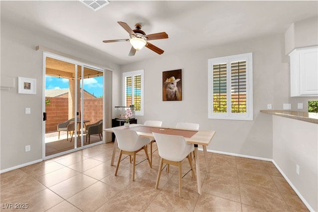 11139 Zarod Rd, Las Vegas, NV 89135 - dining area with healthy amount of natural light, ceiling fan, and light tile patterned flooring