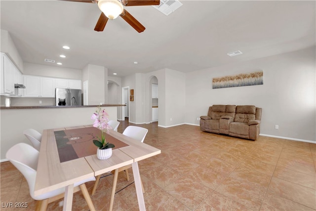 11139 Zarod Rd, Las Vegas, NV 89135 - dining space featuring arched walkways, recessed lighting, ceiling fan, and light tile patterned floors