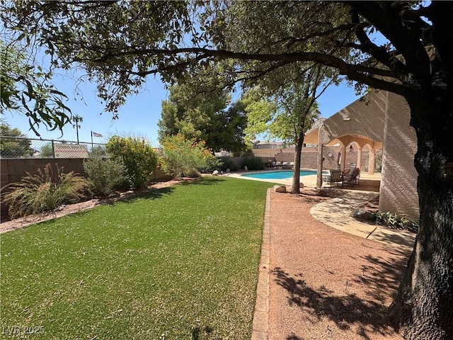 6293 Pavestone Ln, Las Vegas, NV 89142 - fenced backyard with a patio area