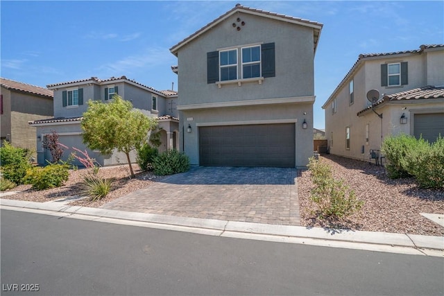 10630 Adobe Ranch St, Las Vegas, NV 89141 - view of front of property with an attached garage, stucco siding, and driveway