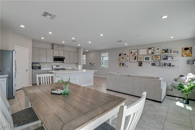 10630 Adobe Ranch St, Las Vegas, NV 89141 - dining room with light tile patterned floors and recessed lighting