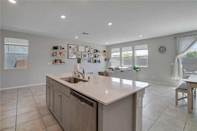 10630 Adobe Ranch St, Las Vegas, NV 89141 - kitchen with stainless steel dishwasher, gray cabinets, light tile patterned floors, healthy amount of natural light, and recessed lighting