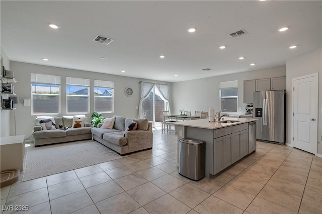 10630 Adobe Ranch St, Las Vegas, NV 89141 - kitchen with appliances with stainless steel finishes, gray cabinets, open floor plan, recessed lighting, and healthy amount of natural light