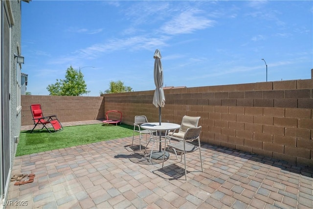 10630 Adobe Ranch St, Las Vegas, NV 89141 - fenced backyard with a patio area