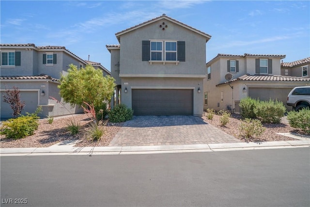 10630 Adobe Ranch St, Las Vegas, NV 89141 - view of front facade with a garage, driveway, and stucco siding