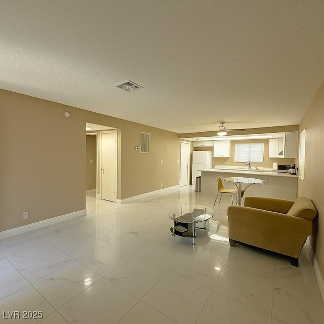 4420 Rich Dr Unit B, Las Vegas, NV 89102 - living area with light marble finish flooring and ceiling fan