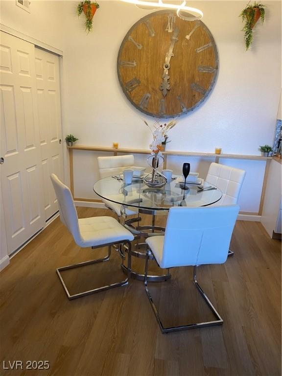 7885 W Flamingo Rd Unit 2129, Las Vegas, NV 89147 - dining area featuring wood finished floors and baseboards