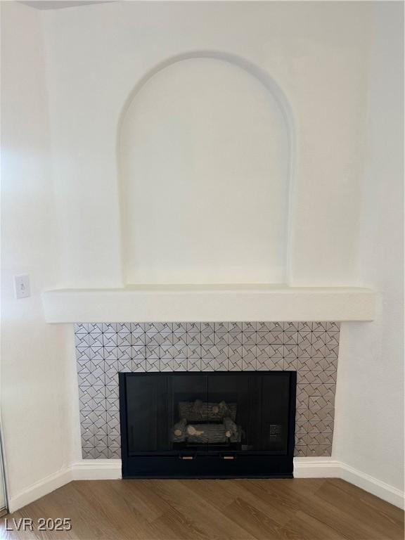 7885 W Flamingo Rd Unit 2129, Las Vegas, NV 89147 - detailed view of a fireplace and wood finished floors