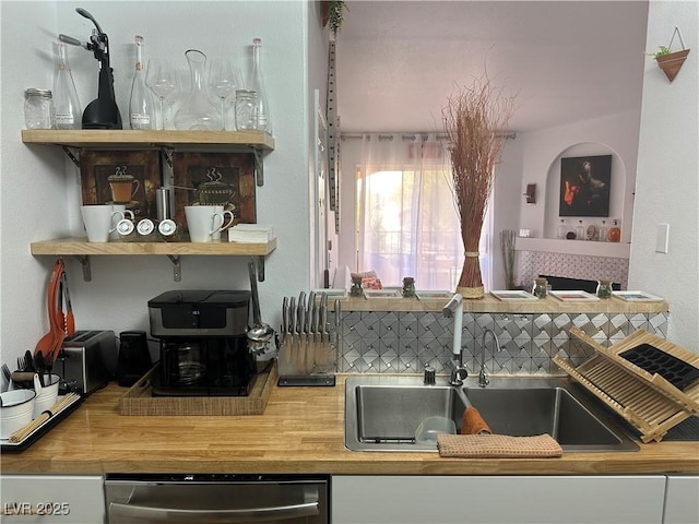 7885 W Flamingo Rd Unit 2129, Las Vegas, NV 89147 - kitchen featuring wooden counters and dishwasher