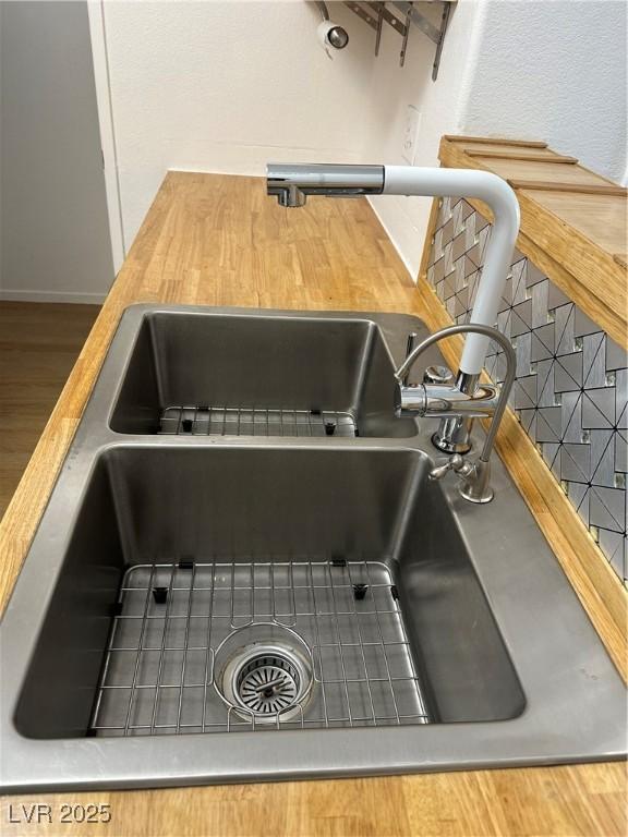 7885 W Flamingo Rd Unit 2129, Las Vegas, NV 89147 - kitchen view of a sink and wood finished floors