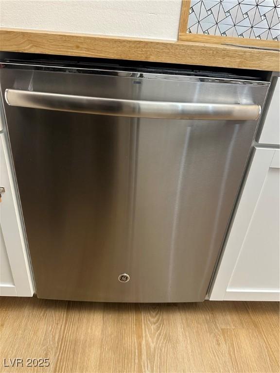 7885 W Flamingo Rd Unit 2129, Las Vegas, NV 89147 - kitchen view of stainless steel dishwasher and white cabinets