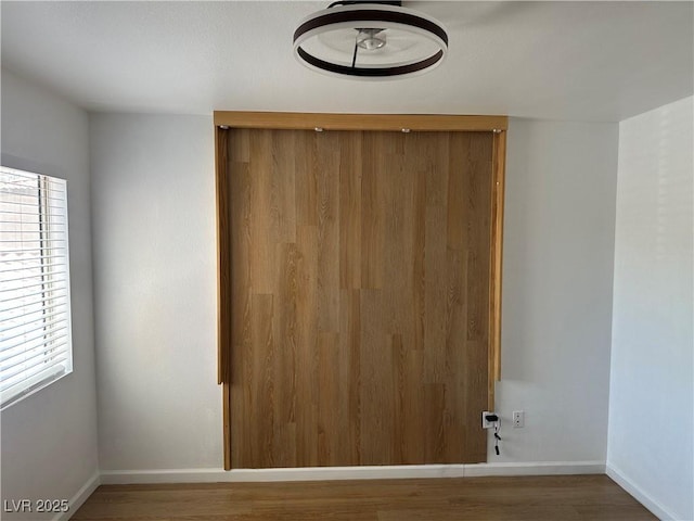 7885 W Flamingo Rd Unit 2129, Las Vegas, NV 89147 - empty room featuring wood finished floors and baseboards