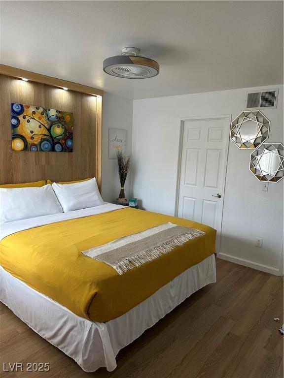 7885 W Flamingo Rd Unit 2129, Las Vegas, NV 89147 - bedroom with wood finished floors and baseboards