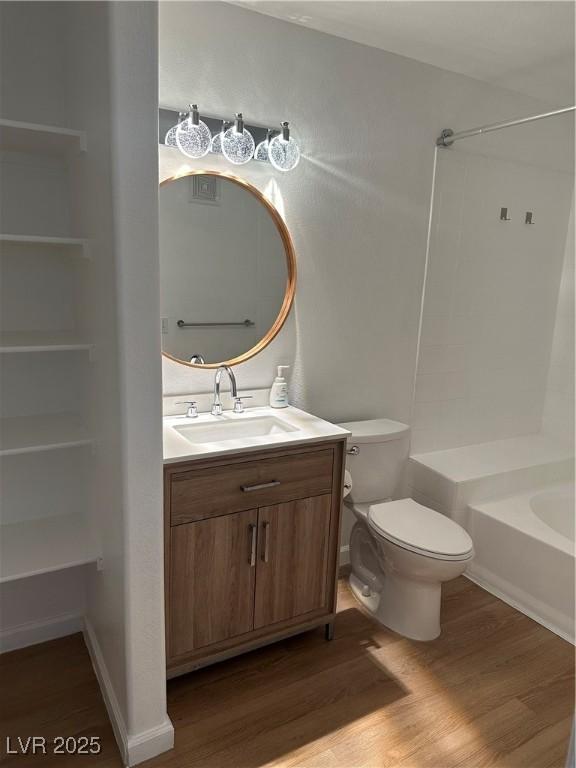 7885 W Flamingo Rd Unit 2129, Las Vegas, NV 89147 - bathroom with wood finished floors, vanity, and  shower combination