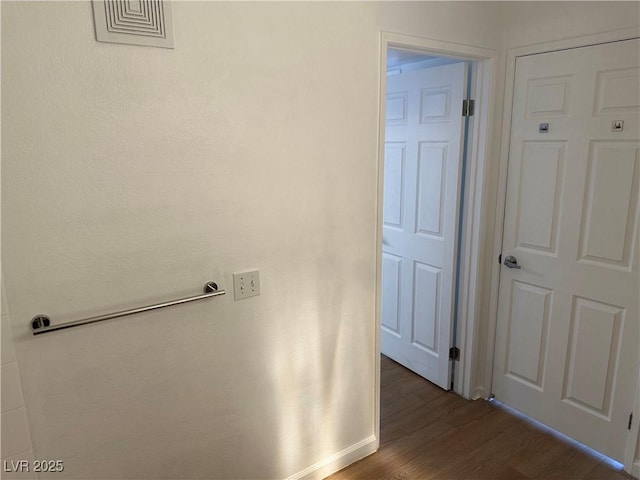 7885 W Flamingo Rd Unit 2129, Las Vegas, NV 89147 - corridor featuring dark wood-style floors and baseboards