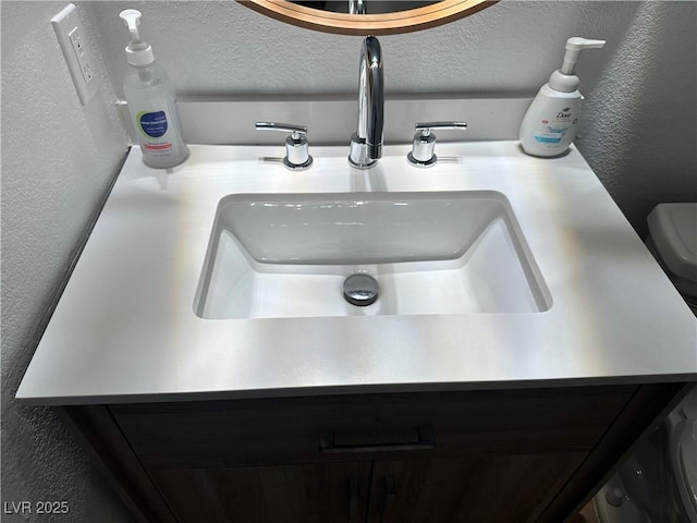 7885 W Flamingo Rd Unit 2129, Las Vegas, NV 89147 - bathroom view of a sink and a textured wall
